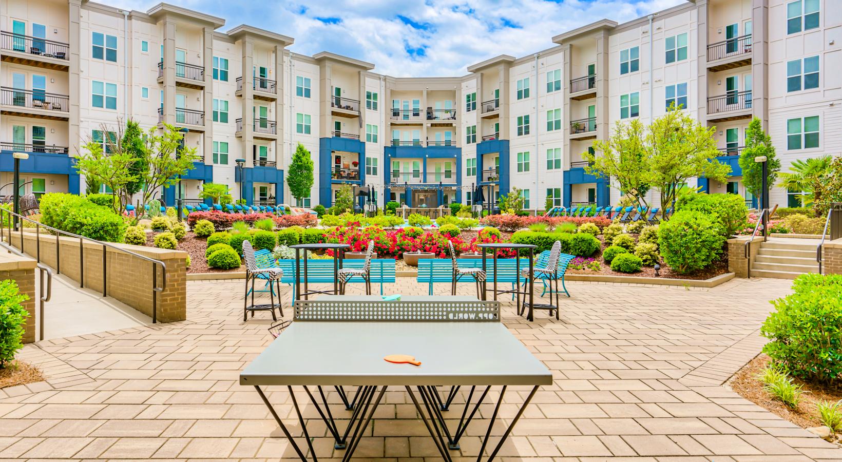 Convenient Lifestyle Amenities | a table and chairs outside