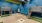 a room with blue walls and a ladder