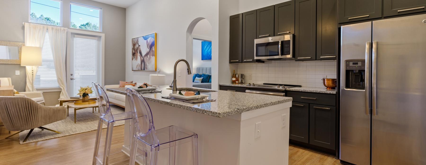 a kitchen with a bar and a table