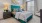 a bedroom with a bed and lamps