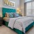 a bedroom with a bed and lamps