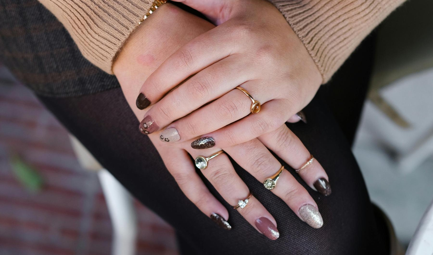 a woman's hands with rings on her fingers