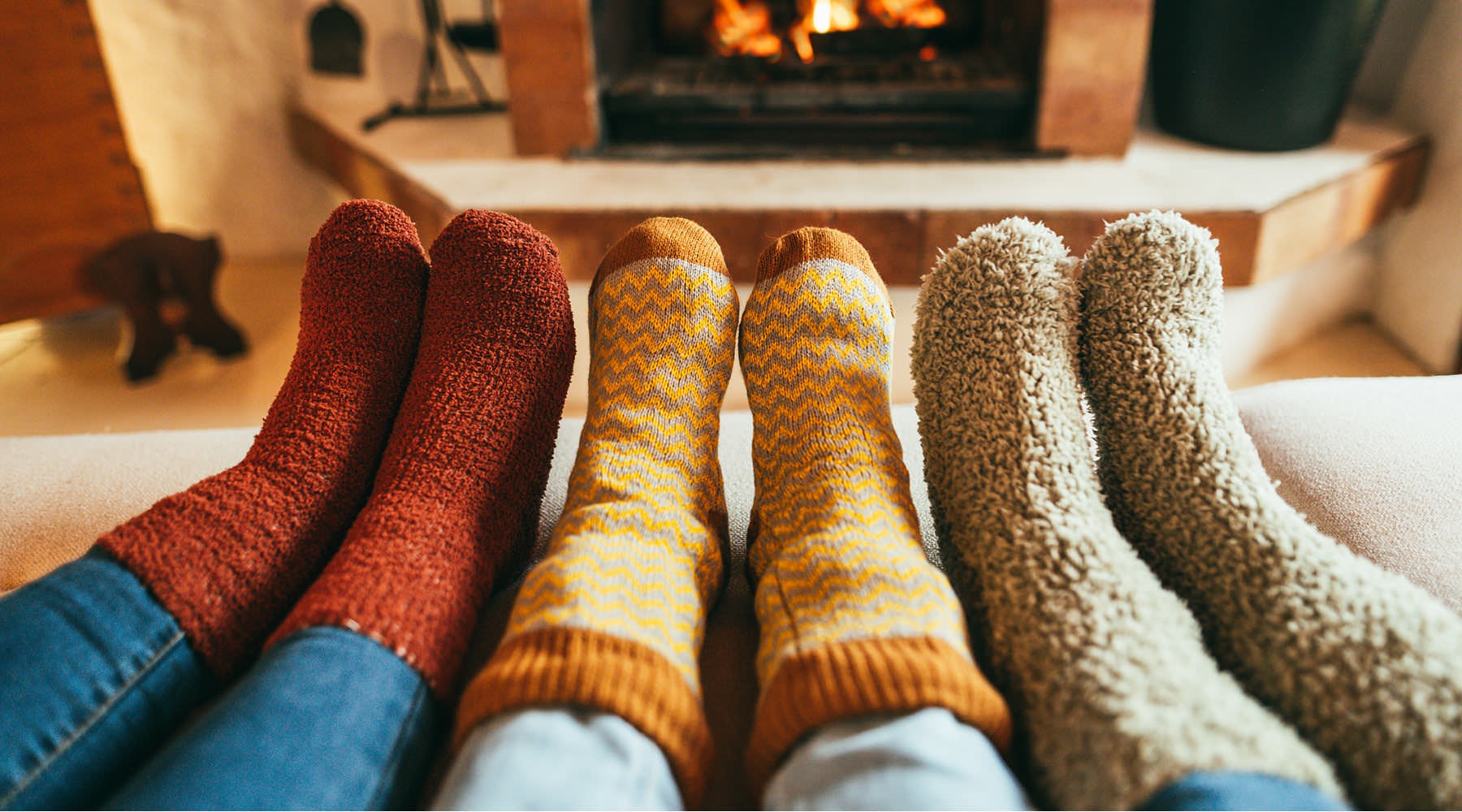 The essence of exceptional living a pair of feet in front of a fireplace