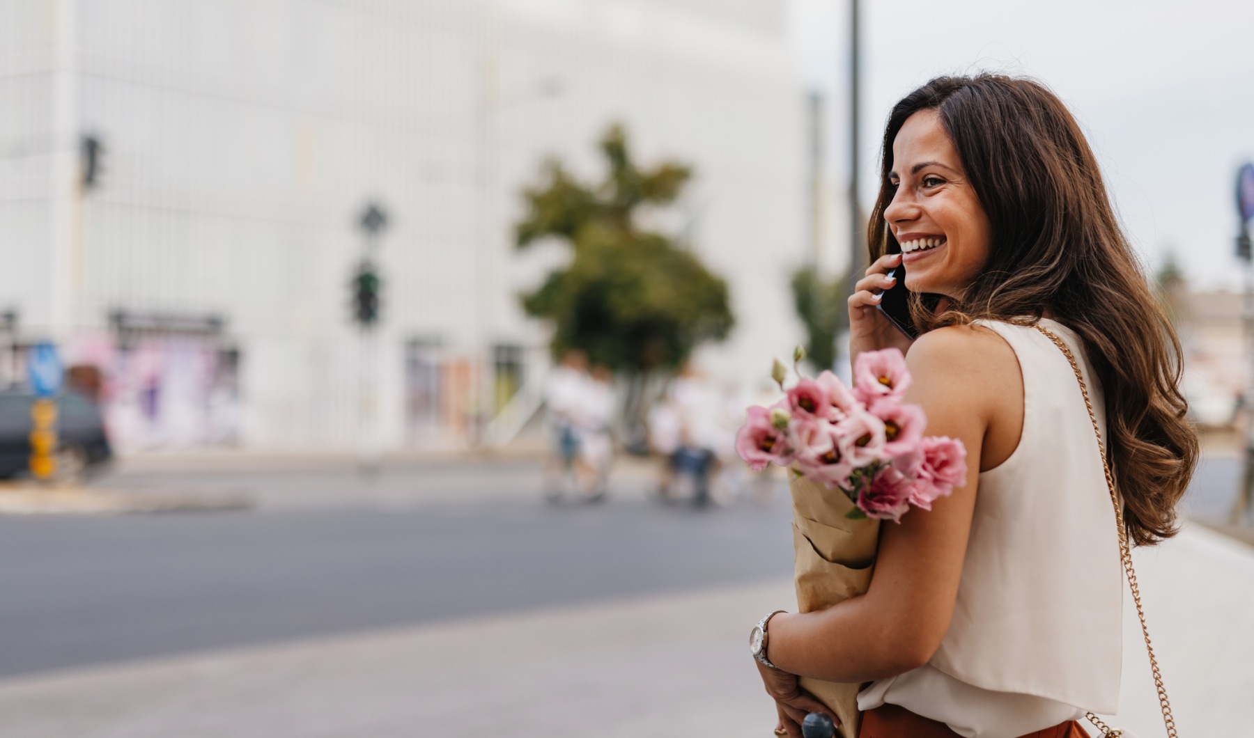 woman enjoying a market with fresh flowers