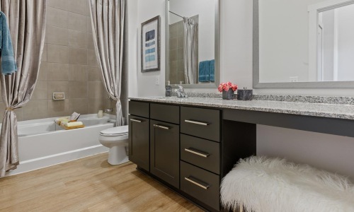 a bathroom with a tub sink and toilet