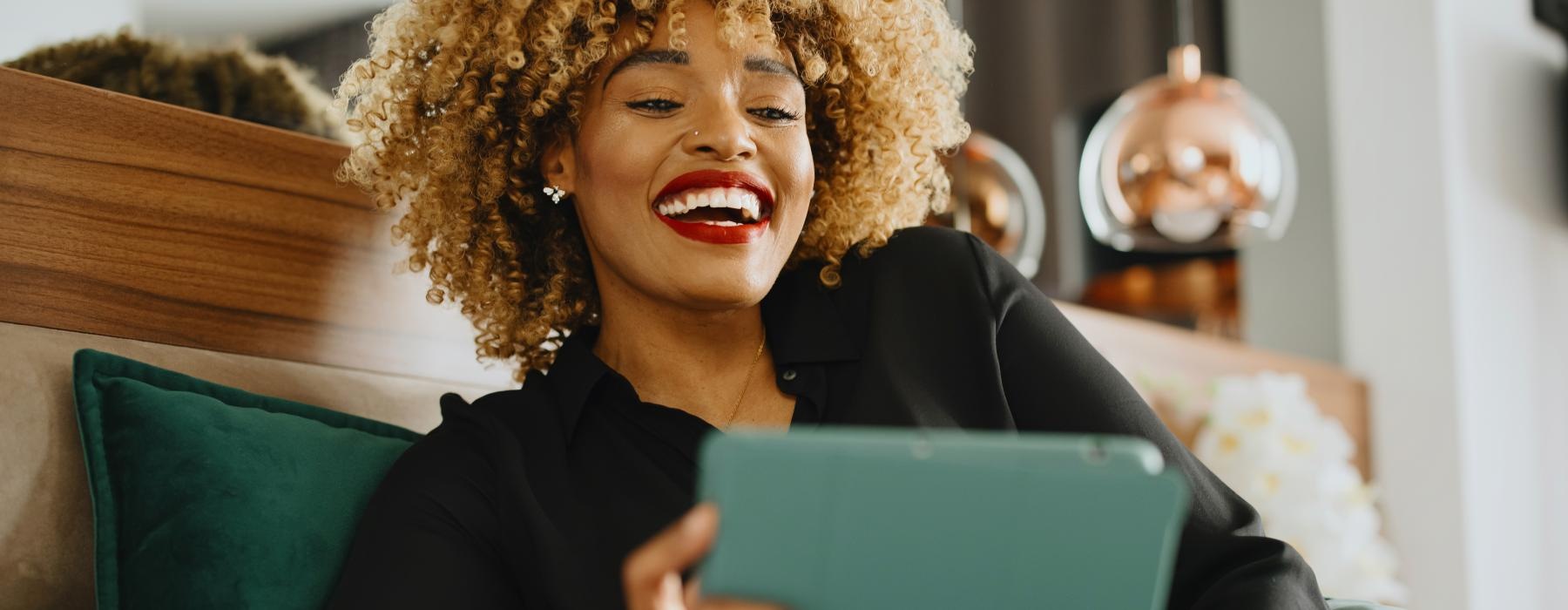 a woman holding a laptop